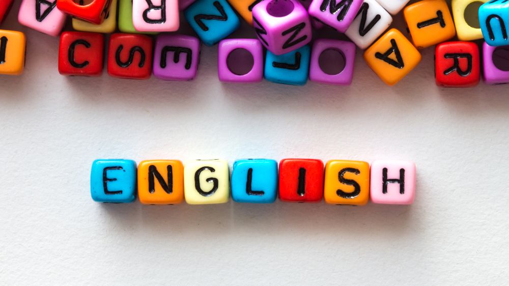 The word ENGLISH spelled using colourful square beads (photo illustration by Colourbox).