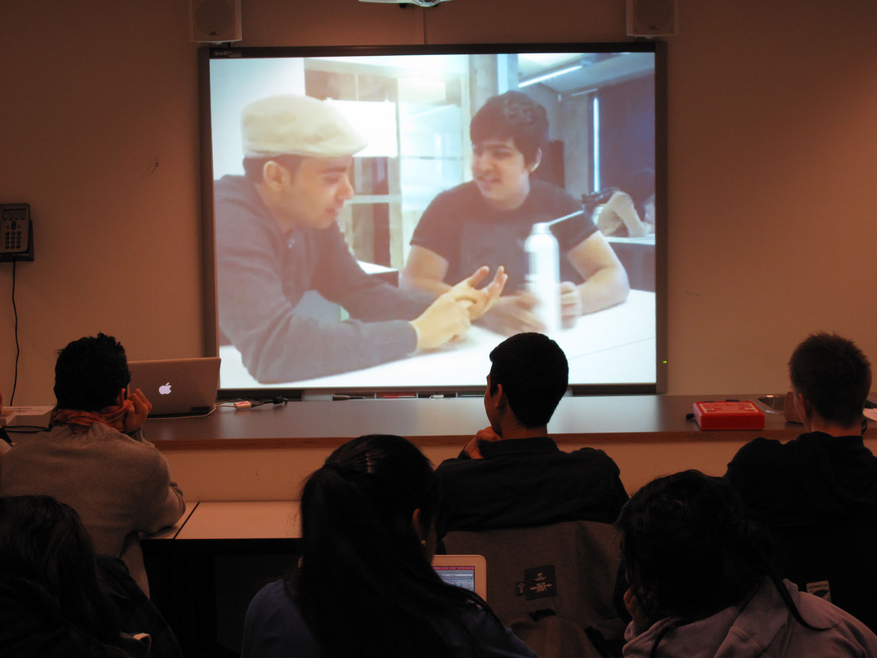 Picture of students in front of a screen