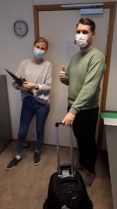 Our researchers, Kristin Simonsen (left) and Dzan Zelihic (right), leaving our lab with research equipment.